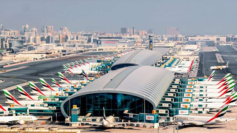 Tourists starting Dubai city tour directly from airport with private car and guide.