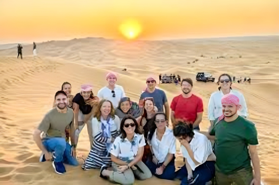 4x4 vehicle driving across Dubai desert dunes during a standard desert safari tour