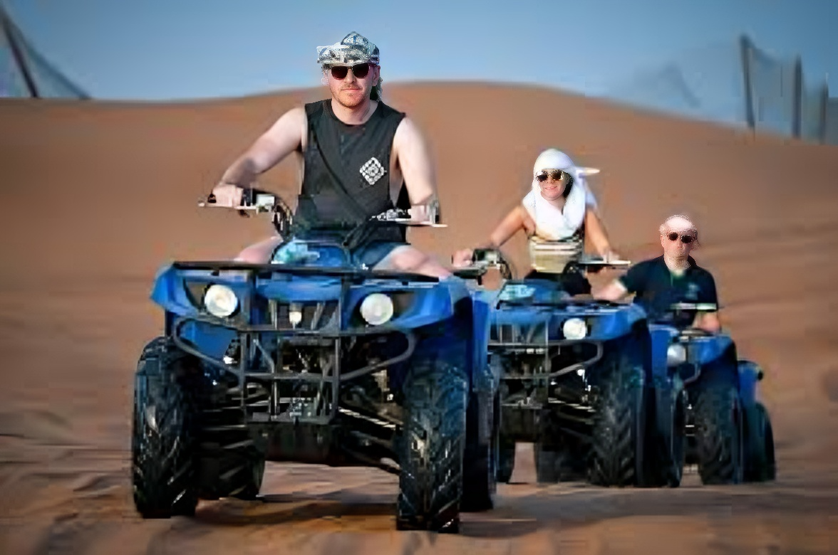Tourist enjoying quad biking in Dubai desert safari